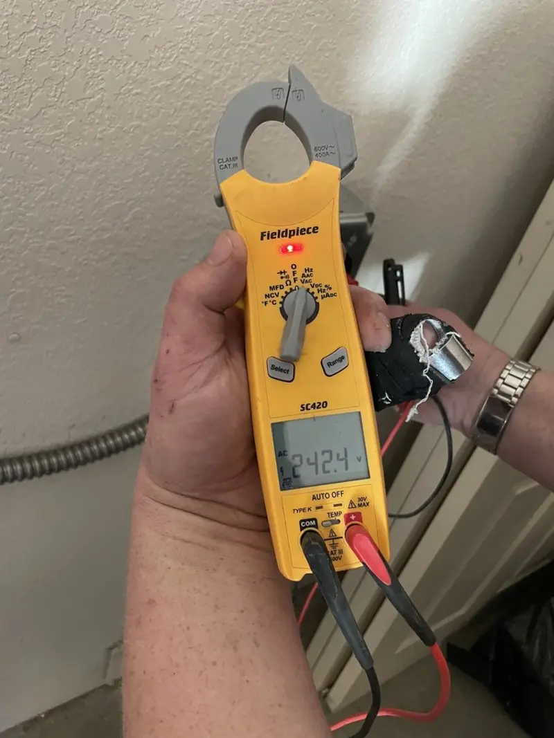 Voltage testing with clamp meter during Generator Installation in Murfreesboro